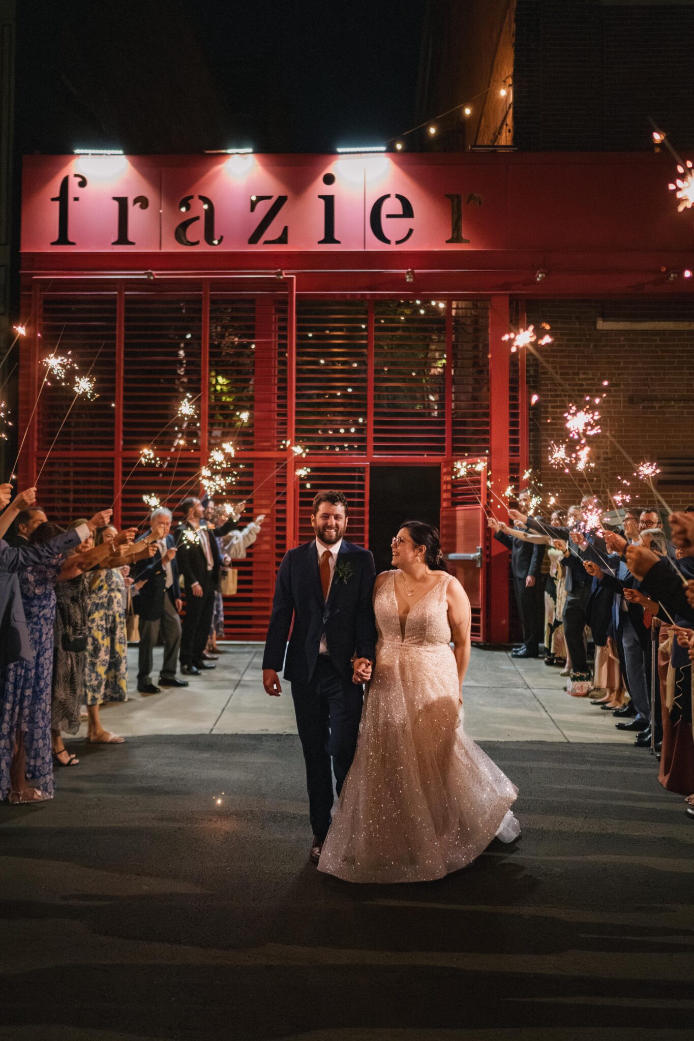 Bride and groom sparkler exit outside Frazier Museum, wedding planned by Louisville wedding planner Michaelis Events | Photo by Sarah Katherine Davis