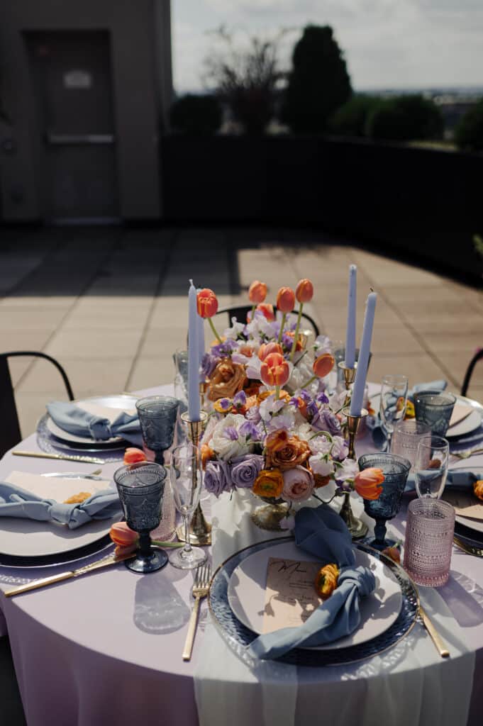 Best Wedding Florist in Louisville, Kentucky - Michaelis Events wedding purple roses and blue flowers with a garden design on the rooftop at Frazier History Museum in Downtown Louisville KY Best Wedding Florist in Louisville, Kentucky - Michaelis Events wedding purple roses and blue flowers with a garden design on the rooftop at Frazier History Museum in Downtown Louisville KY