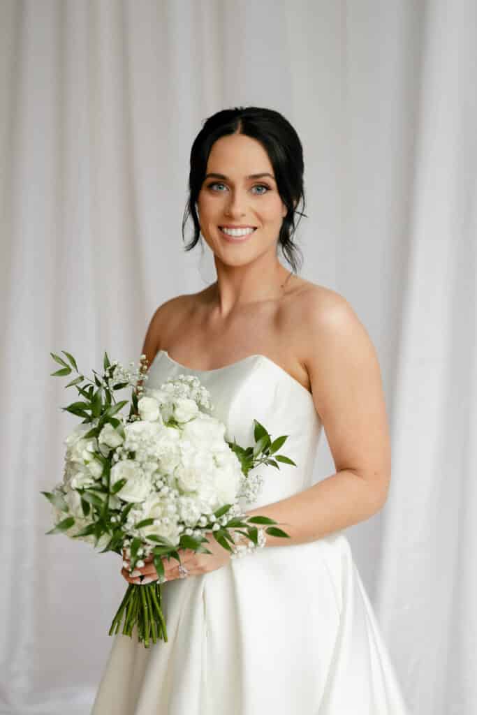 Michaelis Events in Louisville KY Florist for weddings and events. White, ivory, and greenery bouquet bride at The Pointe wedding venue in butchertown ky. Michaelis Events in Louisville KY Florist for weddings and events. White, ivory, and greenery bouquet bride at The Pointe wedding venue in butchertown ky.